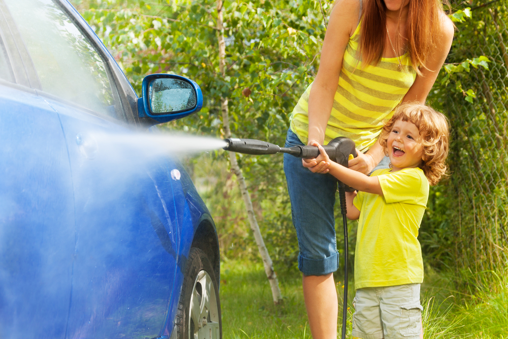 mother and son washing car in Desborough, Northamptonshire